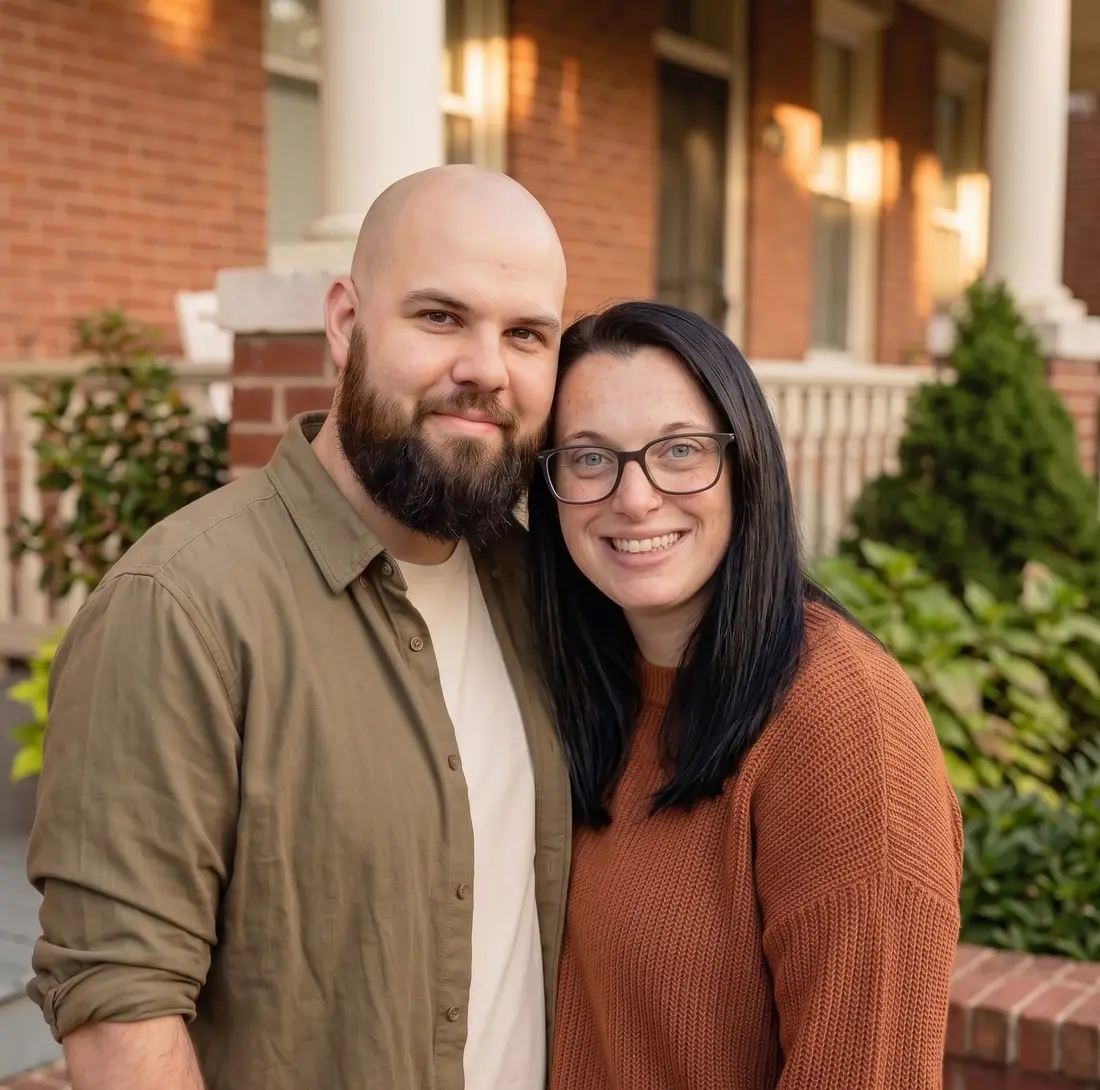 Matthew and Marisa Larkin, the local family behind Deep Roots REI, on a Baltimore front step.